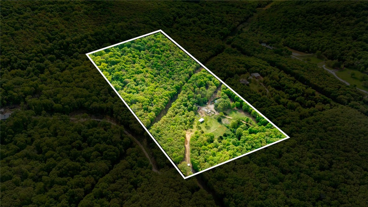 20 Acres that backs up to Kessler Mountain and located just past the Farmington High School! This unique property has a 4 bedroom, 2 bathroom home and plenty of room to have a few animals or even build your own bike trails. The property has all the utilities including rural water, natural gas, electric and internet. If you're looking for your own private land that's still close to all the amenities of town then this may be it!