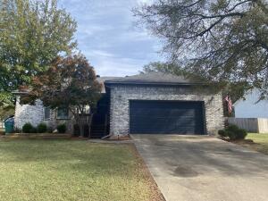 This cute and cozy house in a well established neighborhood has new paint, new carpet, and new tile in primary bathroom and laundry. Cozy wood burning fireplace and vaulted ceilings make the living room feel large and welcoming. The huge fenced backyard and climate controlled garage offer the perfect flex spaces. This one is move in ready!