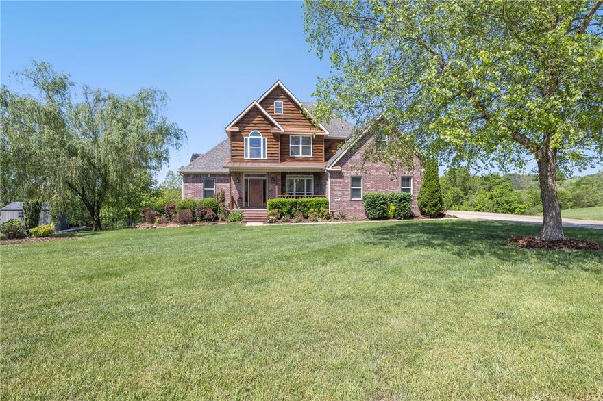 Lake Lovers! This beautiful home comes with the opportunity to also own, at an additional cost, one of the four boat slips in the private boat dock at the end of the street. Private lake access is approximately 200 yards. Love to fish? This is your neighborhood! Enjoy the primary bedroom on the main floor with three more bedrooms upstairs and another bedroom in the finished lower level. Main laundry room is on the main level. Install a stove in the lower level kitchen and you can enjoy a full apartment with a walk-out space. Additional Washer/Dryer Hookups also on this floor. Neighborhood is only 20 minutes to Tyson Foods, 35 minutes to Walmart Home Office, and 35 minutes to the University of Arkansas. Ask about the boat slip!