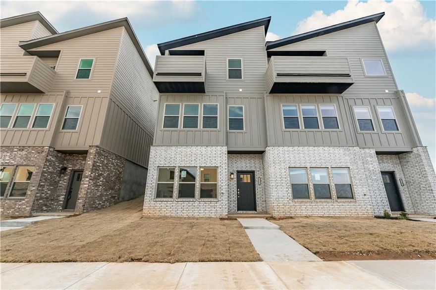 Beautiful townhome located in the heart of Fayetteville! Enjoy easy access to I-49, Sam's Club, Casey's, the University of Arkansas, and more! This townhome has great views of the neighborhood from the upstairs master balcony, LVP flooring, granite counter tops and custom cabinetry throughout home, custom interior design, walk-in showers and walk-in closets! Enjoy the space and privacy of both bedrooms having their own full bathrooms upstairs! (no sharing required) Downstairs holds the spacious second living room with storage closet that can be turned into a fitness room, media room, office space, man cave, or whatever you decide! Refrigerator, Washer, and Dryer included!