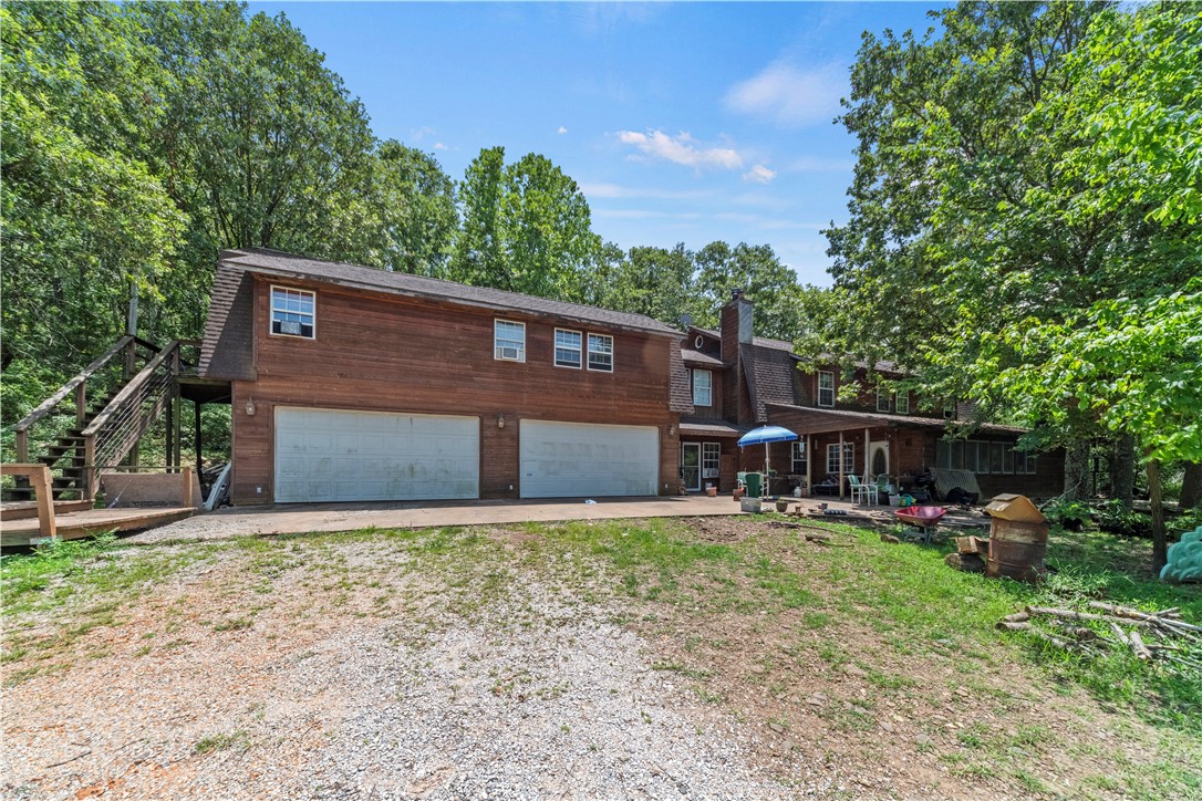 Are you searching for something unique with plenty of square footage and some land? Well do I have a place you need to check out! When you arrive at this unique property, you are greeted with a home that features 6+ bedrooms & baths designed with 3 completely separate living areas. Each area or "home floor" consists of a kitchen, living room and separate bedrooms. The main living area contains a massive kitchen area with island for entertaining. The 2nd and 3rd living areas contain a fully functiional kitchen, living room space, bathrooms and bedrooms. This home is perfect for entertaining, a business, family fun, B&B, Airbnb & more! Multiple EVERYTHING makes this One and Only home what you've been waiting for. As a bonus there are 2 water heaters and 220 electrical outlets are available throughout the home and garage. Everything in house conveys except desk, rocking chair and Seller's personal items S Come and see what ALL of this is about and let's make a deal!