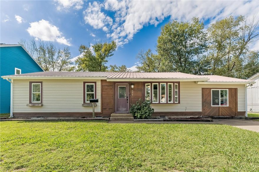 Up to $5000 in flex cash with approved offer! Welcome home to this rare, beautifully updated 4-bedroom, 2-bath gem that marries comfort, style, and convenience.  Open-concept flow with fresh fixtures and contemporary touches throughout: quartz counters, stainless appliances, shiplap backsplash, large sink, and custom built-ins. A framed-in electric fireplace anchors the living area with warmth and style. New electrical wiring means peace of mind for years to come. Outside, entertain or unwind on the oversized deck nestled behind a full privacy fence. A 225 sq ft metal shop with dual lofts offers flexible space for hobbies, storage, or workshop needs. EV charging hookup. Location is key — this home is nestled on a quiet street and is just steps from Westwood Elementary, Murphy Park, and within a mile of Springdale High School. Imagine walking your kids to school or enjoying weekend strolls through nearby green space. Easy access to I-49, shopping, dining, and community amenities rounds out this ideal package.