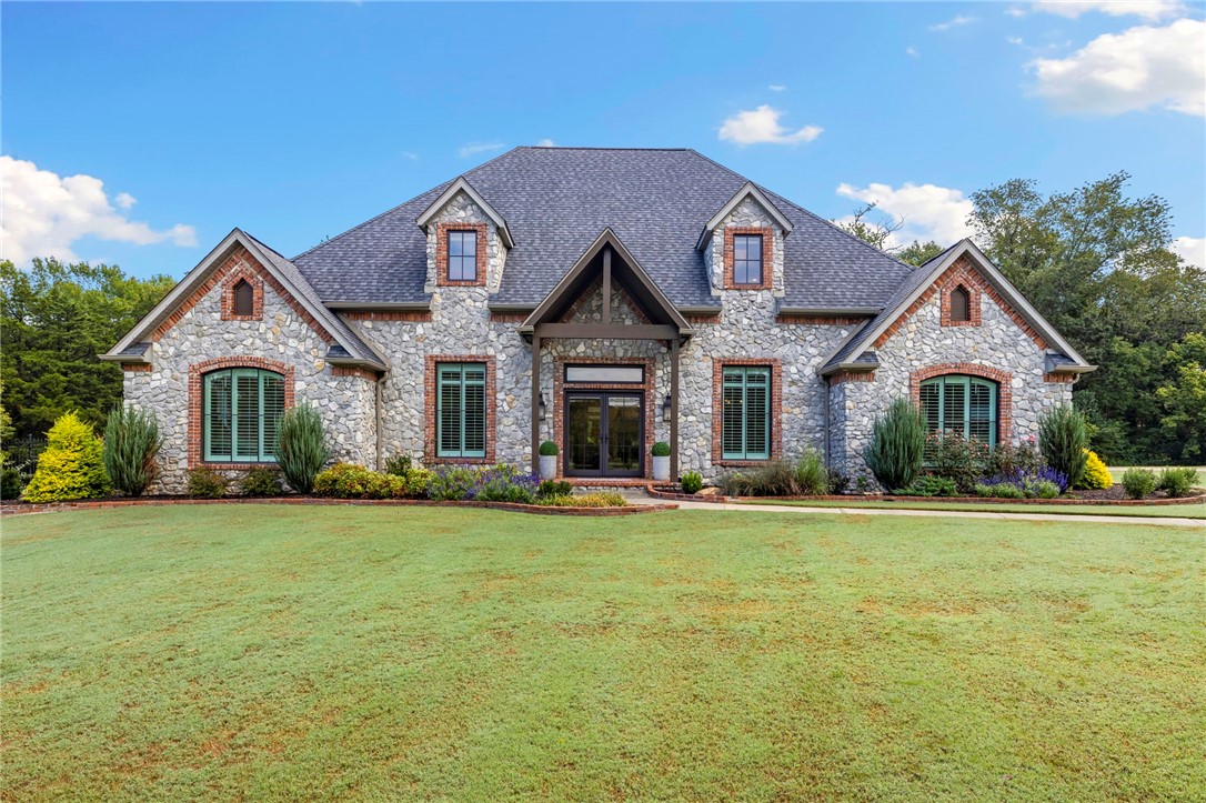 Welcome to 596 Polo Estates Drive, where outdoor living meets modern comfort. This fully remodeled 4 bed, 3.5 bath home sits on 3.30 acres with a private pond, sparkling pool, and walking distance to the White River for fishing, kayaking, or simply enjoying nature. Inside, you’ll find open living spaces filled with natural light, a chef’s kitchen with granite countertops and custom cabinetry, and a primary suite designed for relaxation. Multiple living and flex areas provide room to spread out, while large windows keep you connected to the stunning surroundings. Whether it’s mornings by the water, afternoons poolside, or evenings gathered under the stars, this property offers a true Fayetteville retreat just minutes from town.