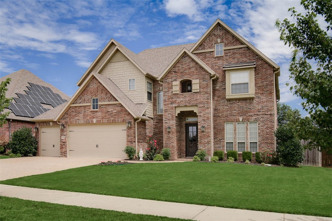 Gorgeous curb appeal in highly sought after Central Park Subdivision! A quick walk to schools, minutes from the Bentonville Community center and a short drive to Downtown Bentonville! This modern home makes an impact with its open floor plan and abundance of natural light and is perfect for entertaining. This Home has 5 bedrooms, 3 1/2 baths, formal dining/or office and a bonus room. The windows in the living room overlook the large covered patio with outdoor fireplace. The kitchen features a large walk-in pantry, gas cooktop, an abundance of cabinets & counter space. The large owners suite features two vanities, corner tub, tile shower and walk-in closet. Huge back yard with wood privacy fence and home has a three-car garage with epoxy floor. Home comes with Refrigerator, washer, and dryer. "Special financing Incentives available on this property from SIRVA Mortgage."