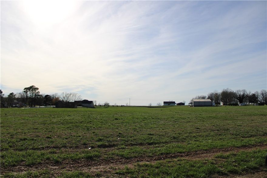 Nestled in a quiet subdivision in Tontitown, this beautiful 1.5 acre lot offers the perfect blend of space, privacy, and convenience. Featuring gently rolling hills and several mature trees, the property provides a picturesque setting for your future home while still allowing plenty of open space to design the layout you’ve always envisioned.

Located in a small subdivision with larger estate-sized lots, the property includes protective covenants to help maintain the quality and character of the neighborhood. Water, electric, and natural gas are available at the street, and a septic system will be needed.

With a minimum build requirement of 2,500 square feet, this lot is ideal for creating a spacious custom home surrounded by nature. Enjoy peaceful country-style living while still being just minutes from the conveniences of Northwest Arkansas.

Bring your builder and start planning your dream home today.