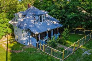 This charming, recently renovated 2- story cottage style home is located within walking distance to Harrison's largest park complete with an all-inclusive play area and a summertime splash pad. the home itself has been updated with sheet rock, new flooring, lighting, shiplap, fencing, exterior doors, interior and exterior paint all within the last 2 years. The third bedroom and bath are in the recently renovated basement apartment. There is not inside access to the basement apartment adding an extra sense of privacy for a mother-in-law quarters, that stay-at-home college student or a home office, yet you are all under one roof.