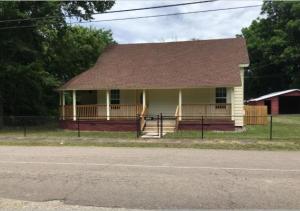 Completely remodeled on inside from ground up! 3 bedrooms, 3 full baths, and large laundry room. All new appliances including refrigerator and washer and dryer. Carpet and tile. Fenced front and backyard. Detached Garage/storage building.