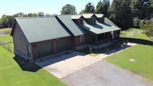 Abundant wildlife lives here! Watch the deer from the huge sunroom of this 4.11 acre country home, and bring your fishing pole as the 1 acre stocked pond houses Brim, Bass and Catfish! Enjoy cozy fires in the sunken living room around the gas log fireplace after tinkering in the two car detached shop. You will love the oversized master bedroom with a jetted tub in the master bathroom! Call today for a personal tour!