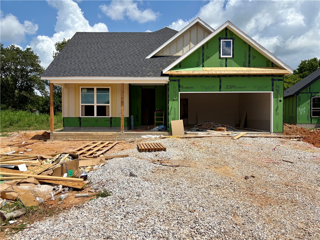 Pea Ridge is a fast-growing community in Northwest Arkansas, and the Concord neighborhood is a great place to find your perfect home. Featuring well-maintained landscaping, beautiful scenery, and affordable housing options, Concord offers a friendly and inviting atmosphere that appeals to a variety of lifestyles.The Stork Plan offers 4 spacious bedrooms, 2.5 bathrooms, and thoughtfully designed living spaces that are bright, functional, and welcoming. The open-concept layout creates a seamless flow between the kitchen, living, and dining areas, making it perfect for everyday living and entertaining. The kitchen is a standout feature, with generous counter space, ample cabinetry, and a large walk-in pantry with built-in shelving. The primary suite includes a private bath and walk-in closet for added comfort. Outside, enjoy both covered front and back patios—ideal for relaxing or hosting gatherings. This home combines style, comfort, and practicality for modern living.