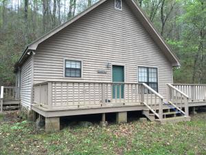 Beautiful cabin hidden on 120 acres surrounded by National Forest. Property sits on 2 creeks, and is perfect for the outdoor loving Buyer. Canoeing, fishing, hiking to Murray Falls, and hunting deer and turkey can all be done from home!