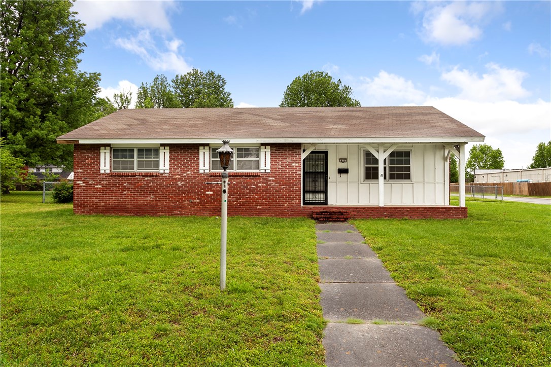 Nearly half an acre corner lot in a great historic neighborhood in Springdale! This 3 bed, 2 bath, 2 car garage boasts an original stone wood burning fireplace, fenced in back yard, and covered front and back porches. Great location close to Sunset (HWY 412) & sits midway between I-49 and 71B. Easy access to walk to many local amenities since commercial zoning is nearby. Own a home in a well established neighborhood. Seller will not make repairs to the home.