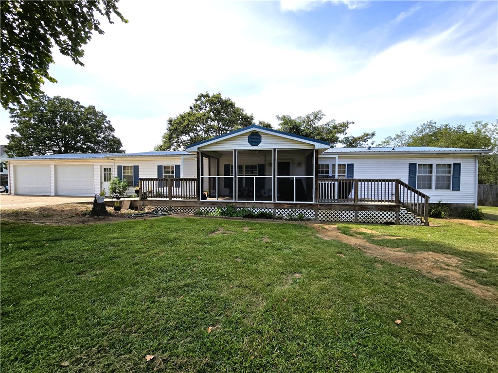 ***Public Real Estate Auction Thursday, October 9th at 10:00AM.*** 2,056 SF home on 2.09 Acres +/-. 3BR, 2BA home is in a great location just outside of town. Main bedroom has a huge bathroom with double vanity and large soaking tub. Screened-in front porch with a deck on the back. This house is in great shape and has been well taken care of. Home is on a permanent foundation. Just installed is a brand new water line. 2 Car garage, 3 bay shop that has little to no value. Plenty of parking for all your toys, don't miss out on this auction!