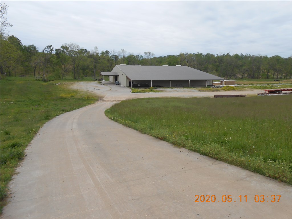 Nice 130 acres, half in pasture and half wooded. 125 x 0 metal building with a 1034 sf apartment, and a 30 x 125 side shed. Small creek and paved road frontage.