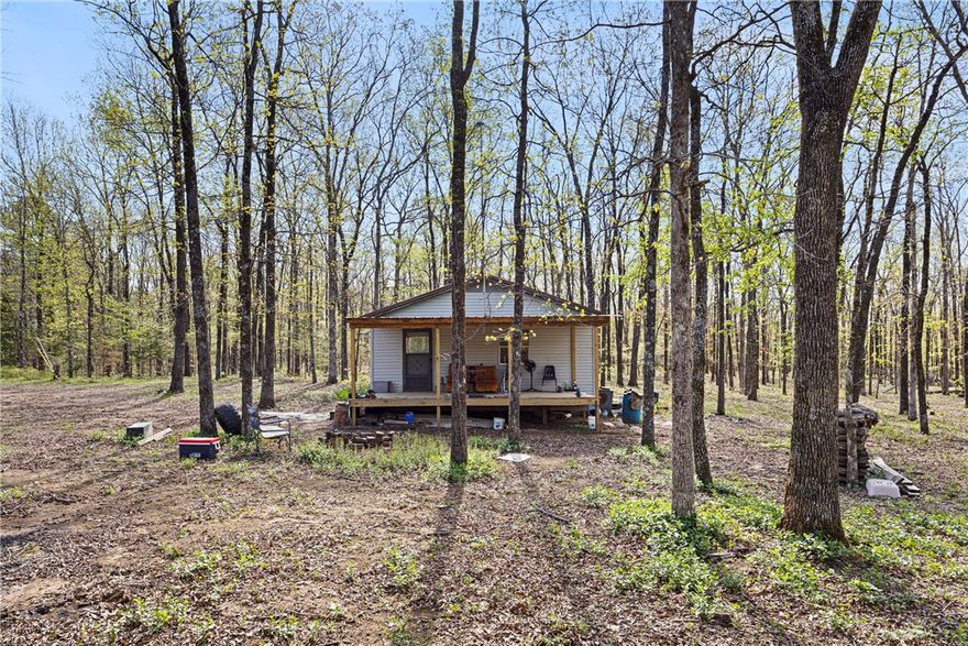 Come escape the noise and discover your perfect hideaway in this country-cozy cabin nestled on 20 acres of pristine, wooded land in beautiful Jerusalem, Arkansas. Whether you're looking for the ultimate hunting retreat, a weekend escape, or a peaceful place to unplug — this is your cabin in the woods.

A hunter’s dream: surrounded by wildlife, mature trees, and the kind of quiet that only the Arkansas woods can offer. Set up your blinds, explore the trails, or relax and enjoy coffee on the porch while the deer wander by. 
With 20 acres of possibilities, this land is full of potential and ready for your outdoor dreams!
Easy access & a secluded area; just far enough out to feel off-grid, but close enough to stay connected when you want.

Don’t miss your chance to own a little piece of Arkansas heaven. Schedule your showing today — this kind of property doesn’t come around often!