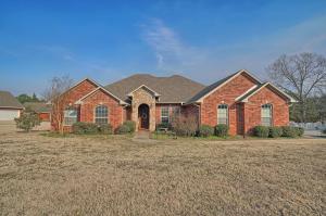 This home is a must see! If you've been looking for a place to call home, look no more. 4 bedroom, 3 full bathroom home located in beautiful Cove Landing in Russellville, Arkansas, minutes from shopping centers, the grocery store and I-40. This home offers 2979 square feet of living space, including a spacious sunroom that features a built-in kitchen with custom grill, ideal for football season. The kitchen is set up perfect for entertaining with an oversized breakfast area. Along with the master bedroom, this home includes a bedroom with an en-suite located off the kitchen. A sizable three-car garage, an office space located off the living room and a fenced in back yard situated on a 0.99 acre lot. This home is priced to sell, so don't let it pass you up. Set up a showing today!