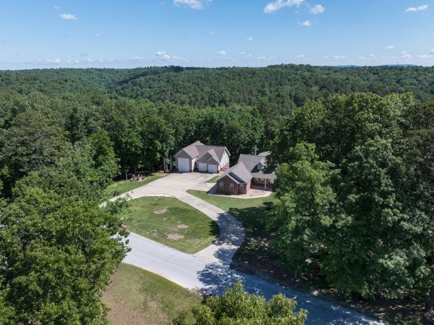 Need space for your RV's, boat, man cave? Here it is! 2125 extra square footage. Tall garage door (14') 16' ceiling and 2 car garage doors. Home is turnkey, all furnishings convey! Including Craftsman work benches and cabinets, polywood furniture on the deck and by the impressive firepit, Purple Leaf patio umbrella, Craftsman 28-gallon air compressor. The house is in pristine condition with whole house generator (20kw)! All this on 5.15 acres with beautiful trees and abundant wildlife. 5 minutes from Prairie Creek Marina!