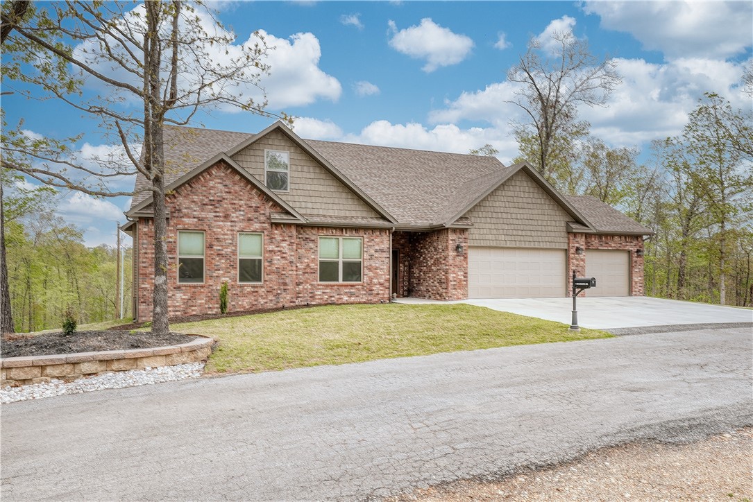 Discover this one-of-a-kind gem situated on a rare .62-acre flat lot with 4 generous bedrooms, 2.5 baths + a dedicated office/flex space, a 3 car garage (22' deep), & an impressive 30x40 shop - perfect for storage hobbies, or a home gym. Step inside to a soaring 12' vaulted ceiling in the living room, creating an airy, open-concept space anchored by a floor-to-ceiling stone fireplace. Flanked by oversized windows, the great room is flooded with natural light & frames scenic views of the surrounding landscape. The kitchen boasts ample counter space, a walk-in pantry, & seamless flow to the dining and living areas ideal for entertaining. Sit outside on the peaceful, covered back porch and take in the tranquility. With easy access to 49, commuting is a breeze. Located only 1 mile from Branchwood Rec Center, you are minutes away from some of the communities best amenities that include: over 100 miles of MTB trails, community pools, fitness centers, golf courses, pickleball, tennis, & archery. This one is a must see!