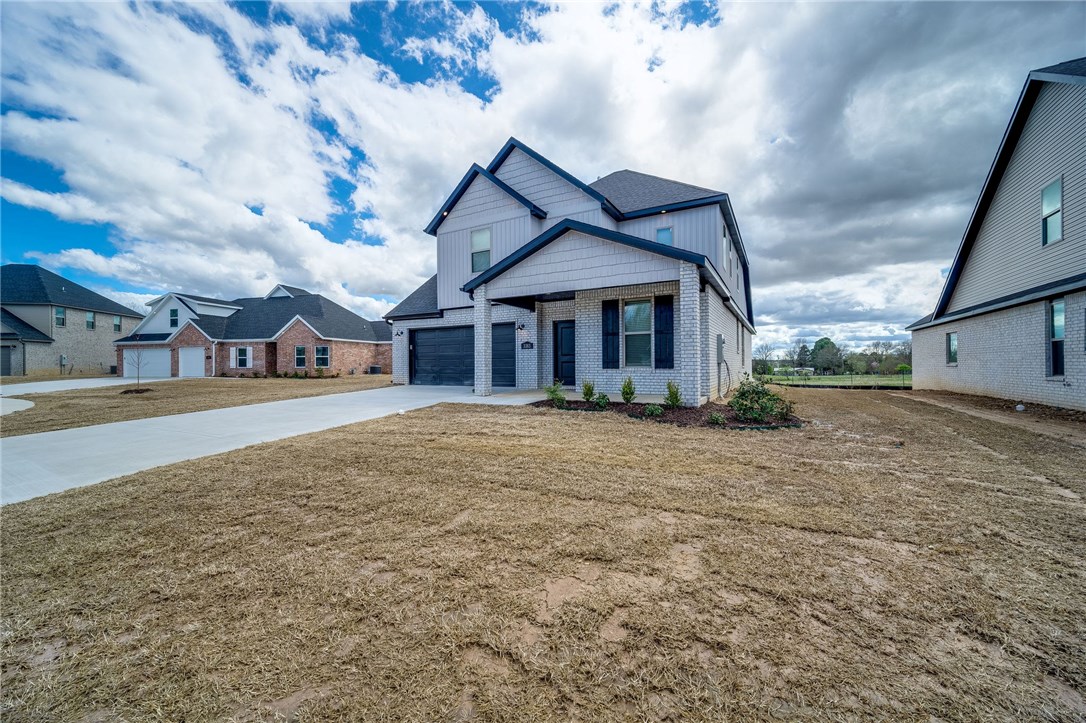 In the stunning new Subdivision of Northern Heights. The perfect location close to schools and business districts. Brody plan boasting 2 levels with 4 bedroom and 2 1/2 bathrooms! Open floorplan, study with french doors and large kitchen. Hardwood floors and epoxy garage floors. Gas fireplace, granite countertops, stainless steel appliances, pantry and much more. Brick exterior with professional landscaping! Enjoy the covered patio overlooking the large acre lot.