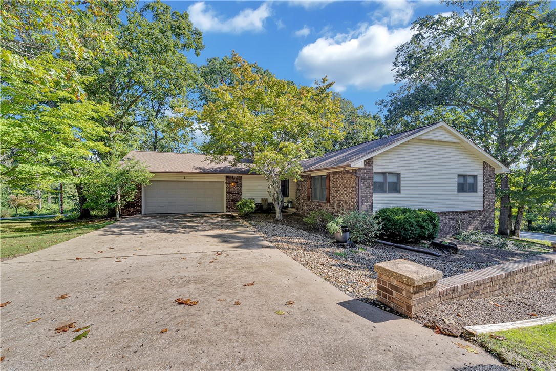 Step out your door and hit the Little Sugar Trail system just 200 feet away, with Avalon Lake and Tanyard Creek only minutes down the road. This updated home sits on a double lot with Lake Avalon just right down the road. Inside the remodeled kitchen features quartz counters, a new cooktop with range hood, a custom coffee bar and new LVP flooring. Other updates include new carpet in bedrooms and on stairs, LVP in main wet areas, and fresh paint in living areas and bedrooms. Other amenities include a large finished walkout basement with wet bar, a screened deck, and an oversized 2-car garage.There is POA property on the road that goes down to the lake creating a stellar opportunity for all outdoor enthusiasts.