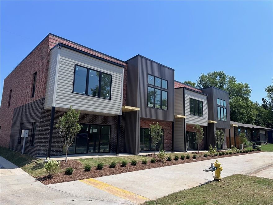 One block from the new Walmart Home Office Campus and just minutes from the down town square. Great space with this modern industrial vibe. Lots of storage in this 2 level 3 bed 2 1/2 bah town home features open floor plan, all wood style flooring, quartz counter tops, stainless appliances, large island. Primary includes large shower with two shower head, large walk-in closet and a private balcony. Pets negotiable and include additional pet rent and non-refundable deposit.