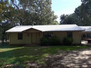 Lots of square footage in this opportunity fixer-upper. Big covered deck on back, covered parking, lower level walk-out. Sold as is, where is.