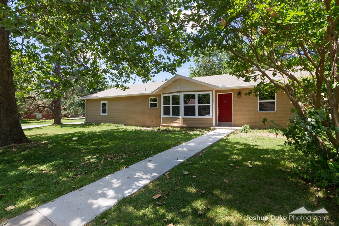 Perfectly updated home in a great location. Freshly painted, granite counters, glass tile back splash, new tile and carpet along with wood like laminate flooring. 1850 sq ft boast 4 bedrooms, 2 updated baths, large utility room and a 2 car attached side entry garage. 4th bedroom would make a fantastic office. Kitchen has stainless steel appliances and an island with bar area. Home sits on a large corner lot. A must see to appreciate.