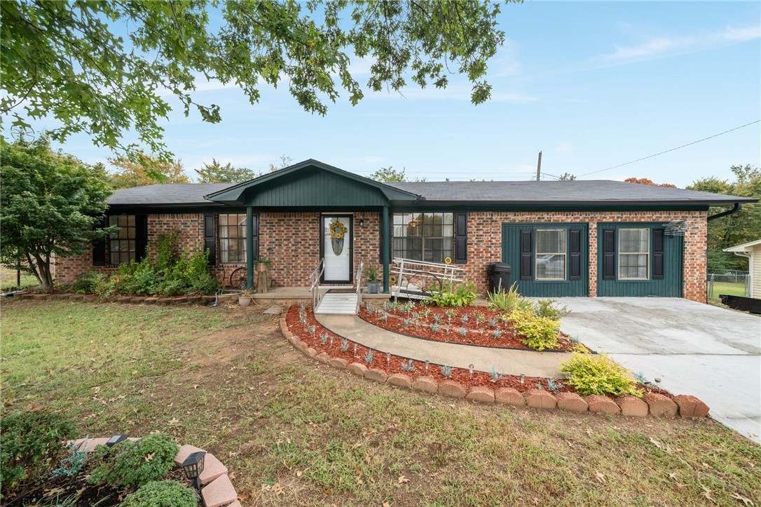 This charming home is move in ready, appliances included! Sitting on a large cul-de-sac lot it backs up to green space with no back neighbors. There is drive up access the the work shop (220 power) and a fenced yard for the pups! You will enjoy the quiet back deck, covered and decked in durable trex decking. The interior is so spacious! The kitchen flows easily into the dining and livingroom. Just off the living room is a large room that can be storage or an office. The bedrooms are traditional in layout and have large closets. The breaker box, hvac, and water heater updated in the last 3 years. Accessible ramps will be removed at closing. Owners are willing to paint the teal areas white prior to closing with an acceptable offer.