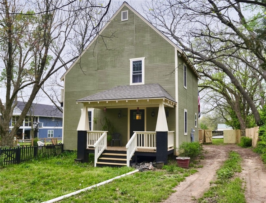 Unique, custom-built home on .43 Acre lot close to everything downtown Prairie Grove. The home features 2 convenience kitchens, 2 full baths and 2 bedrooms. (Formal dining could be converted to a 3rd bedroom if desired). The generous porch and deck are ready for entertaining or just unwinding while enjoying the beauty of the landscaped back and side yards. Large established garden spot, fencing, privacy fencing and more.