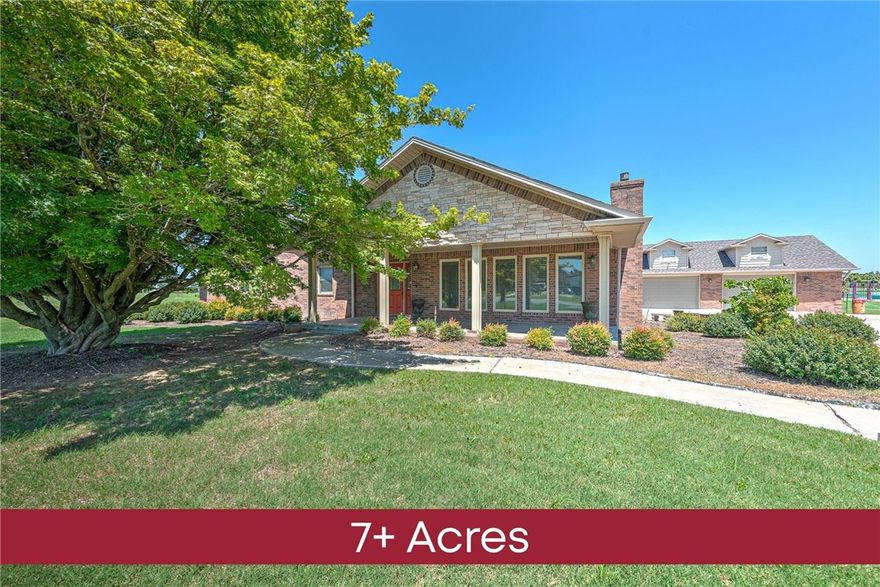 Dreaming of wide open space without giving up city access? This unique property offers two parcels totaling nearly 7 acres, your own private slice of Northwest Arkansas. Whether you're looking to spread out, start a hobby farm, or just enjoy room to breathe, this one delivers. The home itself is spacious at 3,719 sq ft, with two large bonus rooms ready to be bedrooms, offices, or creative studios. The eat-in kitchen is perfect for gathering, with ample space and functionality for everyday living. You’ll also find a built-in security system, a covered front porch, and an iron-fenced backyard - great for pets, privacy, or both. Need room for projects or storage? You’ll love the detached buildings on site, including a 2,640 sq ft barn and a 1,800 sq ft shop, totaling 4,440 sq ft of versatile space. All this, and you're just 15 minutes to Walmart HQ, 10 minutes to Downtown Rogers, and minutes to nearby parks and trails for biking, hiking, or a quick nature escape. Don’t miss out, schedule a showing today!