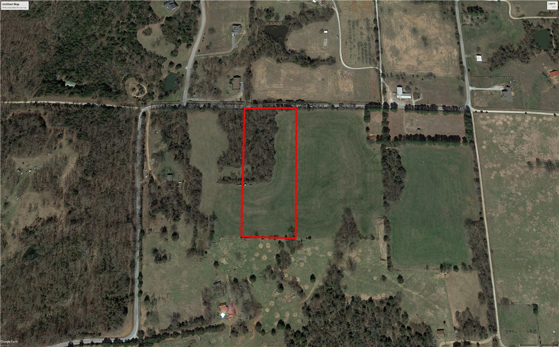 Located in east Fayetteville is this beautiful partially open and wooded 5.33 acre lot - perfect for your new construction home! Blacktop frontage, on public water, Ozark Go available in the area, and in Fayetteville School District. Near Lake Sequoyah Park, 20 mins from Downtown Fayetteville and 10 mins. from Elkins & Goshen. Subject to lot split approval. Agent owned.