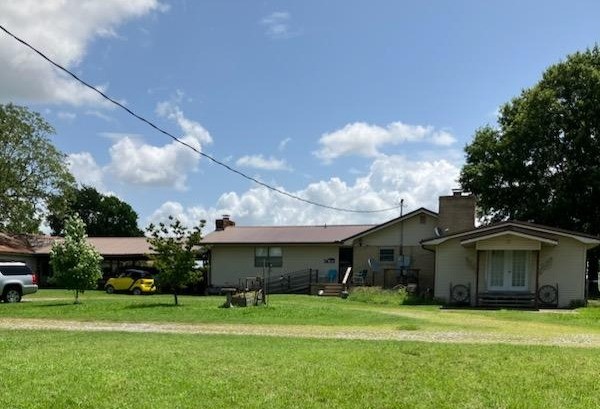 Great opportunity to purchase country home. & land. Many possibilities. Country living, hobbies, recreation, room for business, & shop, pasture for animals. - all in one place !! 3bed/2 bath home with 2 Liv areas poss 4th bedrm.. 2 FP w wood stoves. Good Inground pool 18 x 36 (needs good cleaning ). One bldg has 1/2 bath needs pipe repaired. Good house but could use updating. Lots of room. Buildings have lots of uses. Mostly pasture all fenced. Has 1 good pond. Only 2 mi from town.