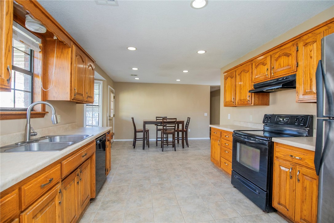 Mature fruit trees, a fully developed garden, all centrally located in Benton County!
Enjoy pear, peach, persimmon, and grapes, all producing fruit! A thriving garden around the property adds even more flavor with spearmint, cantaloupe, jalapeños, basil, sage, and cilantro. Set on a corner lot with a fully fenced yard, this home offers space to relax, entertain, and enjoy your own harvest. Location is a major advantage, with I-49 and the new Walmart Home Office just 7 minutes away, Beaver Lake 15 minutes away, and Restaurant Row only 3 minutes down the road.
Inside, fresh paint gives the home a bright, move-in-ready feel. The covered back patio is nestled amongst your own private orchard and garden, providing a comfortable spot to unwind or gather with friends. With a new roof and two-car garage already in place, this property combines lifestyle and practicality in one inviting package.
This property is priced to sell, schedule your showing soon!