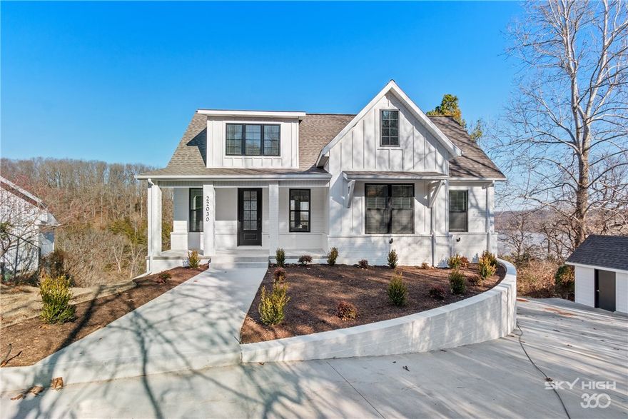 One of a kind home completed in March 2020, curently income producing as a VRBO rental.  Lakefront with private boat dock, fully furnished, turn key property located in a quiet cove.  Leased through the end of August, DO NOT DISTURB tenants.  Showings will be set up through third party management company. Listing agent will have to CONFIRM all showings with management company and times will be limited. Full blinds and gutter package included, outlets with usb charges in all bedrooms and built in bunk bed areas.  Two decks that are 375 sqft each with incredible views of the water and plenty of room relax, air conditioned storage area in basement, treated new staircase down to the water, single slip private boat dock.