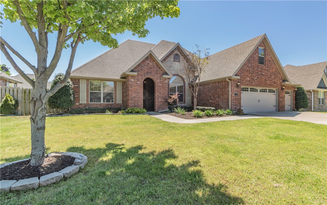 This immaculate, move-in ready home is an entertainer's dream; with a custom-built outdoor pavilion with electricity & a gas starter wood-burning fireplace. The backyard is fully fenced with several mature trees, landscaping & a sprinkler system. Inside you will find a split floor plan with the master bedroom & two guest bedrooms downstairs, along with a formal dining room. The living room shares a double-sided fireplace with the hearth room and eat-in kitchen. Upstairs has a huge bonus room and the fourth bedroom with a private bath and sitting area. Several features include: Engineered hardwood floors, new carpet in the guest bedroom, a whole house intercom system, a storm shelter, and a heated & cooled workshop in the garage. This well sought-after neighborhood comes with a community pool, playground, and basketball court. The home is centrally located and is close to everything. Come see it today!
