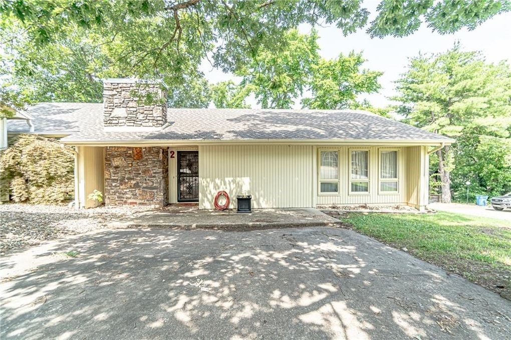 Charming cottage style Bella Vista home! Prime location next to golf course! Recently updated, the living room features stone, wood burning fireplace with hard surface flooring. White cabinetry with lots of counter space in kitchen. Beautiful back porch that runs across back of home. Don't miss out!