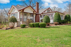 Home & guest cottage!! Classic craftsman style bungalow sitting on 3 acres with large shade trees, perfect for outdoor gatherings.The charming historical home has many original features including built in cabinetry, fireplace & lots of windows for natural light. The spacious living room is open to the dining room, which has french doors to a gorgeous sunroom. The main level has 2 bedrooms & 2 baths. The third bedroom /small study area is upstairs. There's a breakfast room off the kitchen, & large utility/mud room, which opens to the attached two car garage. This home also includes a small guest house w/separate driveway. The large detached garage has room for a workshop. Roof&HVAC system approx 3 yrs old. Sq Ftg/room sizes approx.