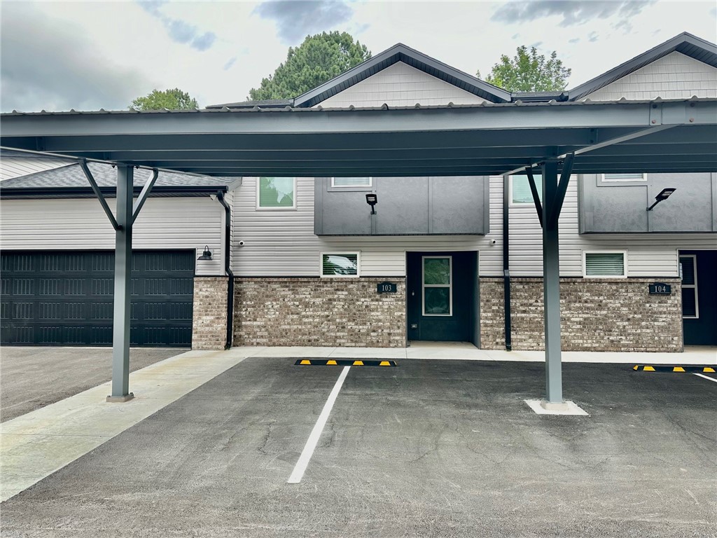 Fantastic 2 bed, 2.5 bath rental with 2-car garage near U of A, shopping, trails, I-49, and everything NWA has to offer! Spacious main floor includes living area, kitchen, laundry, and half bath. Upstairs features two bedrooms with private baths. LVP flooring in main areas, carpet in bedrooms, and ceiling fans throughout. Kitchen includes stainless steel appliances. Refrigerator and full-size washer & dryer provided. Bluetooth speaker system in living room and covered porch. On UA bus route 35! **No Pets Allowed**