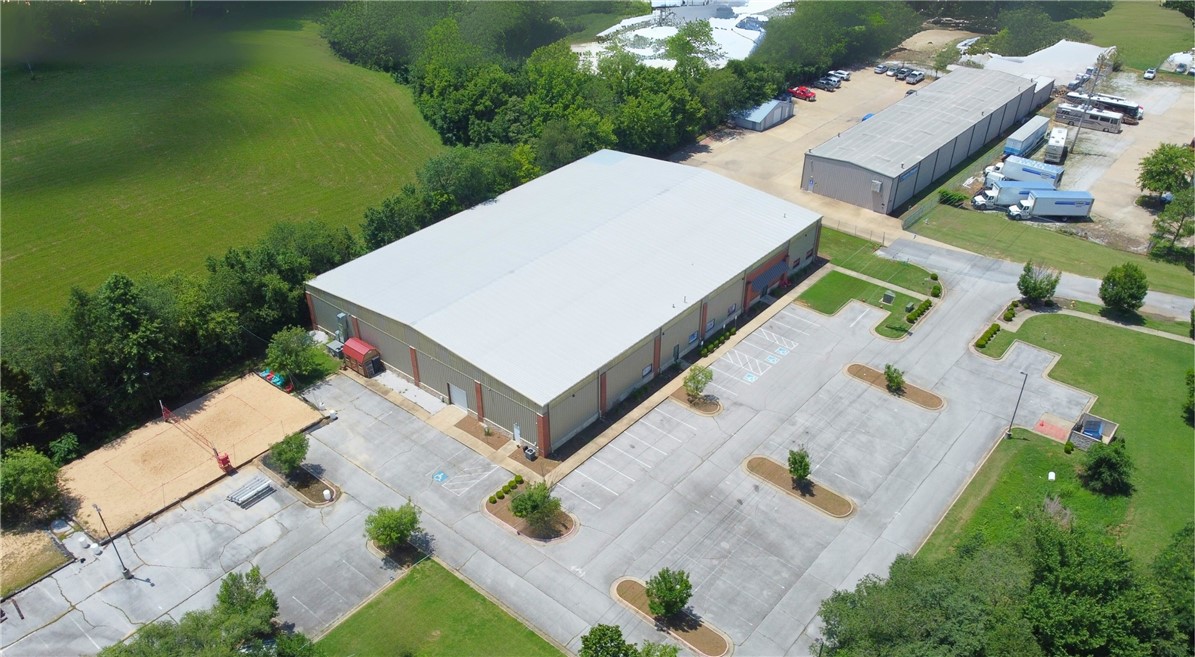 Lease overview:
Building size: 26,357 SF.
Asking rent: $13.50 PSF.
Rent type: NNN.
Grade level doors: 2 (10' x 10').
Min wall height: 22'.
Max peak height: 28' 9".
Parking spaces: 40+.
Power capacity: 450 AMP 3-phase.
Property highlights:
±26,357 sf climate-controlled, two-story warehouse for lease, featuring ±5,290 sf of office space and located just 1.5 miles from Interstate 49. The property has recently undergone several site improvements and includes two 10' x 10' grade-level doors, 22' ceilings, a 28' 9" max peak height, and 450 amp 3-phase power. With 40+ parking spaces and a flexible layout, the space is ideal for a range of industrial or flex users. Future additions include approximately 1.5 acres of outdoor storage, dock-high doors, and an additional drive-in door, unless otherwise preferred.