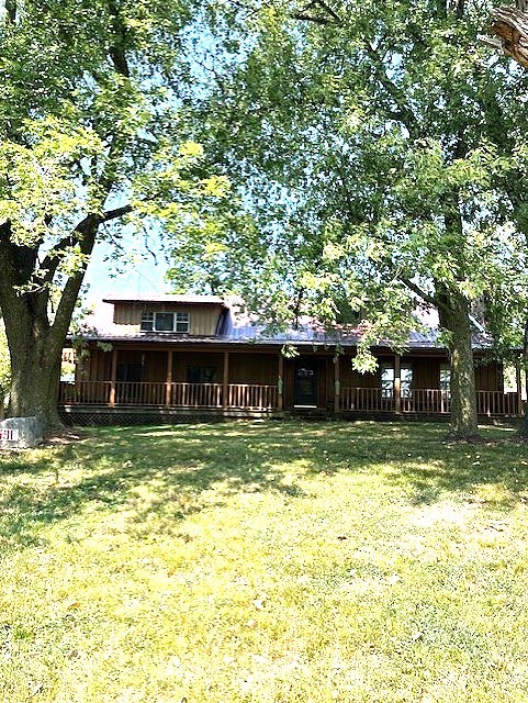 A turn of the century home that was remodeled in 2002. Lots of room and lots of options to make it your own. Hard to find 1 acre lot in town. Large covered front porch with huge shade trees in front. Big screened in porch on back of house. This can be a special place with a little imagination. SOLD AS IS with a $10,000 remodeling allowance with acceptable offer. Close to schools and public park with walking trail. Two storage or shop buildings. Additional 375 sq ft partially finished heated & cooled room. Not included in heated sq footage.