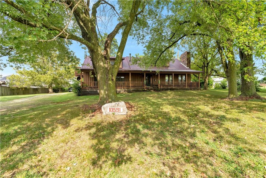 A turn of the century home that was remodeled in 2002. Lots of room and lots of options to make it your own. Hard to find 1 acre lot in town. Large covered front porch with huge shade trees in front. Big screened in porch on back of house. This can be a special place with a little imagination. SOLD AS IS. Close to schools and public park with walking trail. Two storage or shop buildings. Additional 375 sq ft partially finished heated & cooled room. Not included in heated sq footage.