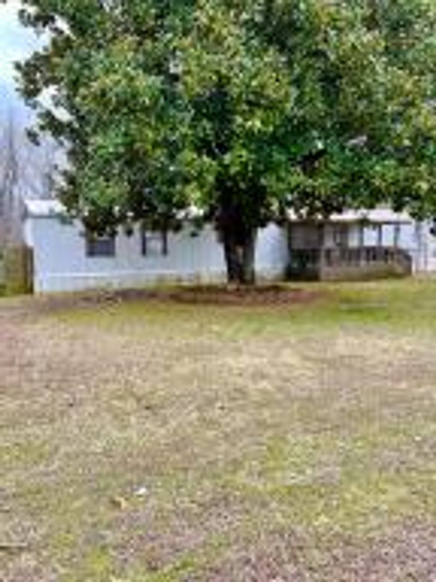 3 Bedroom 2bath mobile home sitting on a little over half acre. Level lot, with mature Magnolia Tree for plenty of shade. Great Location on a dead end road. Couple minute drive to lake Dardanelle Boat Launch.  Less than 10 minutes to Wal-Mart and other shopping.