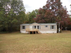 GREAT OPPORTUNITY, this well kept 1286 square foot manufactured home sits on 2.55 acres. 3 bedroom and 2 bath with a nice deck out front to watch the wildlife and a nice side porch for sitting and relaxing. Excellent price!This manufactured home is on a permanent foundation and should go FHA or RD