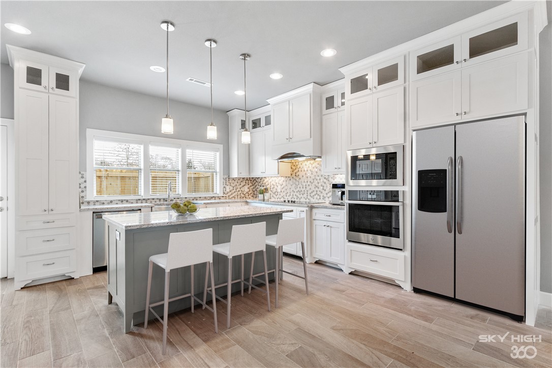Welcome To Your Next Home! Your Downtown Bentonville Living Has Arrived w/ These Brand New 3 Bedroom, 2.5 Bath Townhomes. Fully Loaded w/ Custom Cabinets, Granite Counters, Built-in Appliances, Custom Tiled Shower & So Much More. Wide Open Main Level Living Area Featuring Kitchen, Dining, Living & Half Bath. Master Suite + 2 Guest Beds & Full Bath Up. Fenced Back Patio Area. Each Unit Has Access To A Detached 2 Car Garage. Down To The Last Few, So Don't Miss Out! **Pictures Shown Are Of Same Floorplan, But May Not Represent Exact Finishes Of Unit As The Finishes Of Each Unit Will Vary.