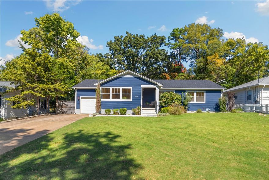 Completely remodeled, custom home in the Fayetteville Washington-Willow Historic District — walking distance to the University of Arkansas, Ozark Natural Foods, the Farmers Market, Dickson Street and the Square. This open-plan 3-bedroom, 2-bath home features abundant natural light and a bonus room flex space over the garage. The eat-in kitchen showcases quartz countertops, custom cabinets to the ceiling, an island with seating and wine rack, stainless steel appliances, a gas cooktop with high-end vent, recessed lighting and a pantry with pull-out drawers and outlets. The primary suite offers French doors to the patio, a custom closet and an ensuite bath. All appliances convey. Rare find in a prime location!