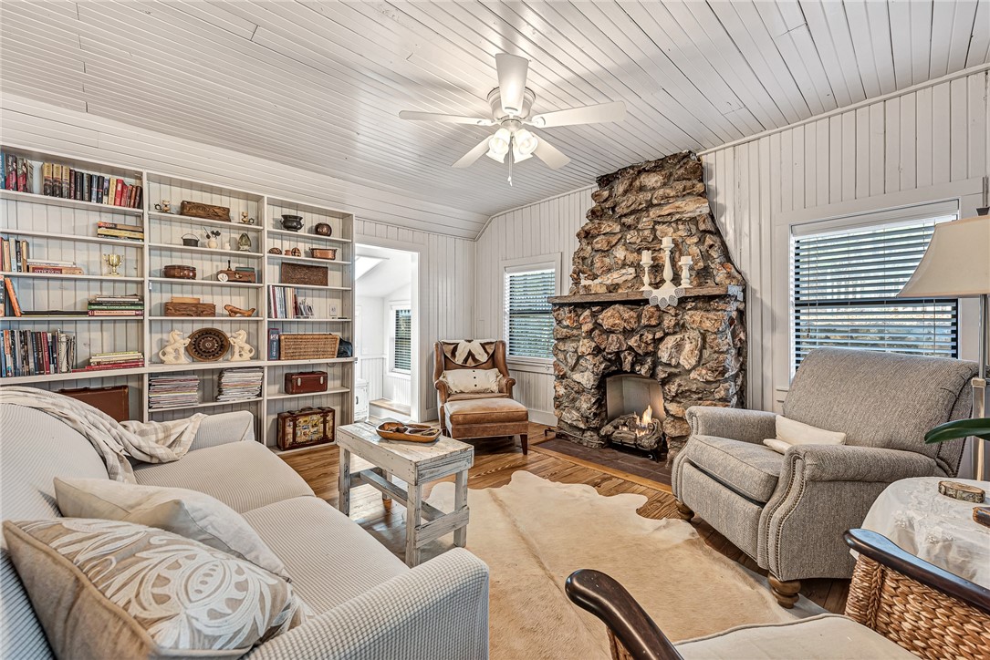 This stunning, historic home has been fully renovated and has been one of Siloam Springs' favorite Short Term Rental/ Airbnb/VRBO. Featured, in the top 7 AR getaways- www.onlyinyourstate.com/stays/arkansas/spring-getaways-airbnb-ar ! Also featured in the Travel FOMO Podcast. The cottage offers amazing views of the NWA Land Trust, Lake Frances Preserve, as well as a 40' long open concept living/ dining room with native stone fireplace on one end, and an 8'x24' screened in deck on the other with a 16' bar, all sitting on the original hardwood floors that have been restored. Perfect for enjoying the scenery year round! The main level also features a custom bathroom with windows wrapping around 2 sides, sky lights and a deep free standing soaker tub. Downstairs has 2 bedrooms, a full bath, laundry room, and another 8x16" screened in deck with an outdoor shower. New HVAC, plumbing, electrical, insulation, appliances, and full renovation in 2021.