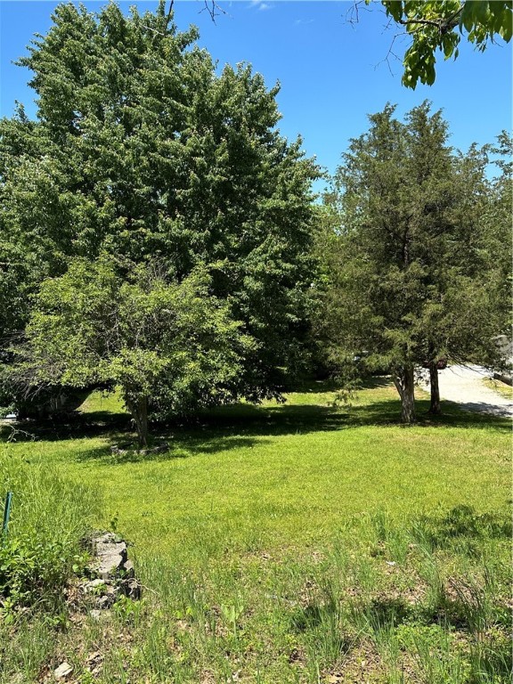 Affordable, buildable lot in Beaver Shores Subdivision. Interior lot in neighborhood of nice lake area homes. Slopes down from street, mostly cleared with some nice trees remaining. Septic required (no current perc test available, but it was previously perc tested & said to allow for 1-2 BR design (info not guaranteed & buyer to perform due diligence). Water & Electric available at street. Dimensions approximately 50'x150' (.20 acre). Corners marked, but new survey recommended. Seller to contribute allowance for part of survey costs at closing with acceptable offer terms.