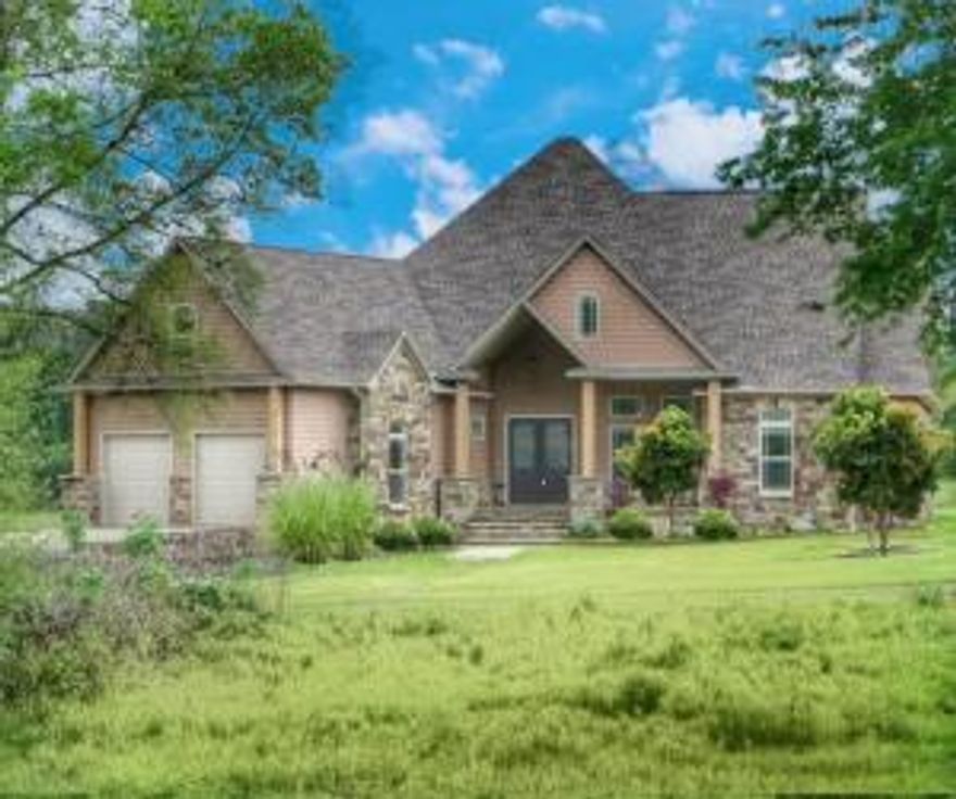 If a luxurious home in the country is what you've been looking for, you just found it! This absolutely gorgeous, custom rock home sits on 5.91 beautiful acres in the Tipton Heights Subdivision. Inside the home, you will be wowed by the open floor plan featuring 14-foot high double crown tray ceilings, native Arkansas stonework, tons of custom cabinetry, granite countertops, and absolutely beautiful flooring throughout. This home has 2 spacious master suites with 10-foot ceilings, walk-around closets with built-in cabinetry, and dreamy bathrooms. Upstairs is another roomy bedroom and bathroom. Outside there is plenty of room to run and play! This home is surrounded by other beautiful homes with the perfect amount of space between neighbors.
