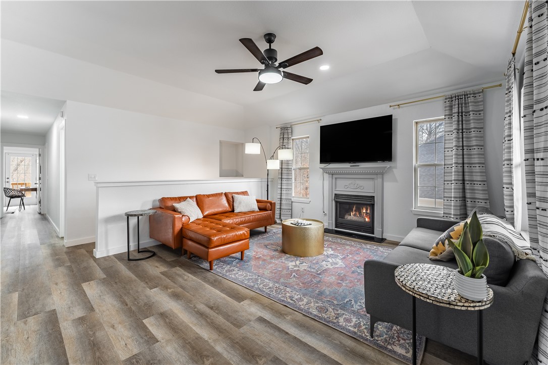 This beautiful duplex was fully remodeled in 2023 and has excellent income potential right in the heart of Bentonville. These units have been short-term rentals but would also be excellent long-term rentals, or live in one side and use the other side for income. Unit A has two bedrooms and two full baths upstairs with one bedroom and full bath downstairs. Unit B has two bedrooms and two full baths with no lower level. Both units have easy-to-maintain luxury vinyl plank flooring, granite countertops, modern and updated bathrooms with new tile, fixutres and lighting. Unit A has a fireplace in the main level and basement living areas. The back yard boasts a pool that can be shared by both units. The Tristan Trail is just steps away and can take you anywhere the NW Arkansas trail system goes. Hop on your bike and in minutes you'll be in the Bentonville Square, Crystal Bridges, the Momentary, or the local schools. This is an incredible opporutnity you don't want to miss!
