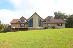 UNBELIEVABLE MOUNTAIN TOP HOME ON 12 PRIVATE ACRES WITH A VIEW! This custom built 5 bedroom 4.5 bath homes has it all! The great room features vaulted tongue-in-groove ceilings, loft sitting/tv area, large game/recreational room in the basement, office, gym area, and a wonderful kitchen that is open to the great room. The large deck and salt water pool are perfect for cookouts and entertaining. And don't forget the 60x40 heated shop that is plumbed for a full bathroom. This home has an unbelievable amount of storage space. New roof in 2017. Don't miss this! Call us today!