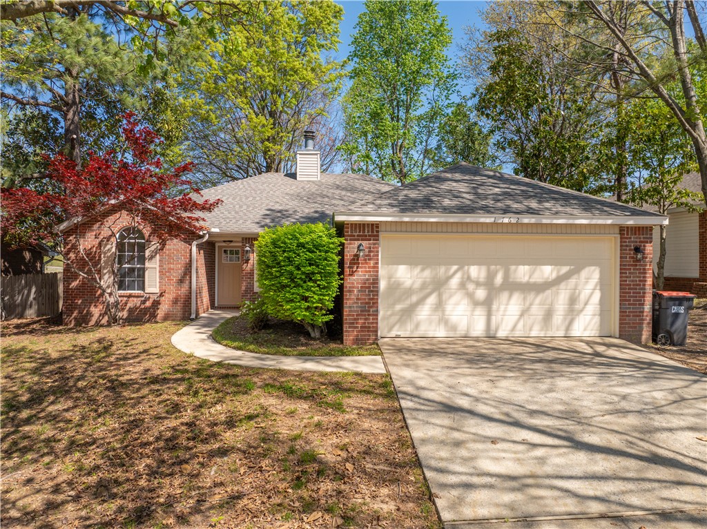 Located in walking distance from Tyson Foods headquarters and 71B, this well-kept home features a desirable split floor plan and brand-new LVP flooring in the living room and bedrooms. The dual-sided fireplace adds a cozy touch, and the fenced backyard with a patio is perfect for outdoor living. Close to shopping, dining, and major conveniences—this one checks all the boxes!